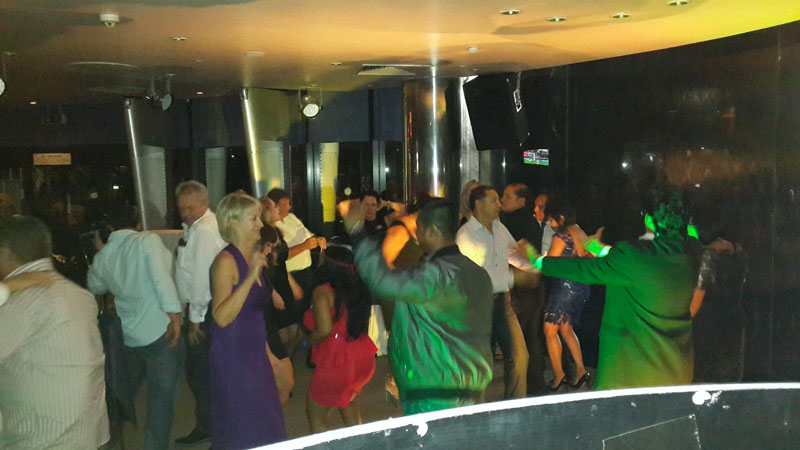 Party guests enjoying local DJ entertainment